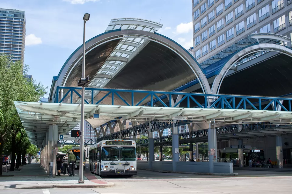 Downtown Houston covered bus station with one parked bus